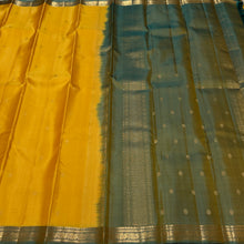 Sahana- Gorgeous Golden Yellow with Dual tone Green Buttas Handwoven Pure Kanjivaram Silk with small beautiful borders rich pallu and contrast woven blouse