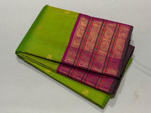 Vaibhogam- Stunning Parrot Green with Fuchsia Pink Handwoven Pure Jari Korvai Kanjivaram Silk with beautiful buttas woven body with rich varisaipet borders beautiful pallu and contrast woven blouse with bottle green selvedges
