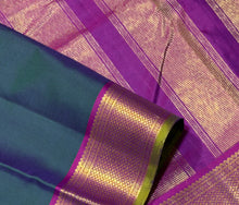 Nayaki- Gorgeous Deep Sapphire Green  with Dark Magenta  Handwoven Pure Kanjivaram Silk with beautiful bawanchi borders with green selvedges with rich pallu and contrast woven blouse