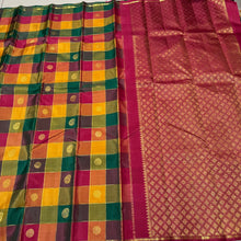 Saranga- Super Gorgeous Handwoven Pure Kanjivaram Silk Saree in a Beautiful Palum Pazhamum Checks with traditional colors with mango and chakram buttas woven in the body with neli veldhari jari lined checks rich woven pallu and contrast arakku red blouse