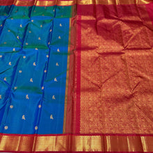 Vaibhogam- Stunning Peacock Blue with Dark Red Handwoven Pure Jari Korvai Kanjivaram Silk with Mayil Kuyil Buttas Woven beautiful body with rich borders veey uniquely woven pallu with elephants flying horses peacocks and contrast woven blouse