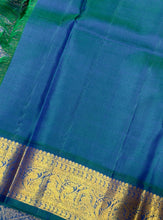Vaibhogam- Gorgeous Burnt Orange with Peacock Blue Handwoven Pure 2g Jari Korvai Kanjivaram Silk with plain body rich borders gorgeous pallu and contrast woven blouse