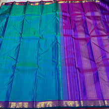 Nayaki- Beautiful Peacock Blue Green with Purple Small Border Handwoven Pure Jari Kanjivaram Silk with rich borders pallu and contrast woven blouse