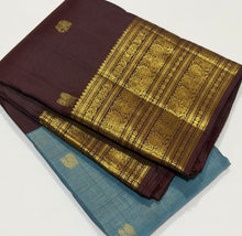 Vaibhogam- Gorgeous Pastel Blue with Coffee Brown Handwoven Pure 2g Jari Kanjivaram Silk with Vairaoosi with buttas woven beautiful body with rich borders pallu and contrast woven blouse