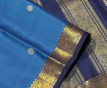 Vaibhogam- Mesmerizing Royal Azure Blue with Navy Blue Handwoven Pure 2g Jari Korvai Kanjivaram Silk with Buttas woven body with beautiful small intricate borders rich pallu and contrast navy blue blouse