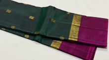 Sahana- Stunning Bottle Green with Dark Magenta Mayil Chakram Buttas Handwoven Pure 2g Jari Kanjivaram Silk with Spaced borders rich pallu and contrast woven blouse