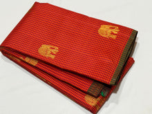 Saranga- Gorgeous Orange with Arakku Kasakasa Podikattam with Elephant motifs woven beautiful body with green selvedges rich pallu in arakku with very intricate weaving and contrast woven arakku blouse