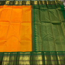 Vaibhogam-Stunning Mango Orange with Emerald Green Handwoven Pure Jari Korvai Kanjivaram Silk with Buttas woven body beautifully woven rich borders pallu and contrast woven green blouse