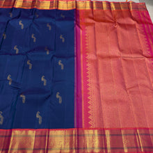 Vaibhogam- Gorgeous Peacock Blue with Orange Pink Handwoven Pure Jari Korvai Kanjivaram Silk with beautiful peacock buttas woven body with rich borders pallu and contrast woven blouse