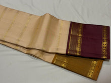 Vaibhogam- Gorgeous Ivory White with Bronze Mustard and Maroonish Brown Handwoven Pure Zari Korvai Kanjivaram Silk with Ganga Jamuna Borders rich doublepet borders rich getti zari pallu and contrast veldhari striped blouse