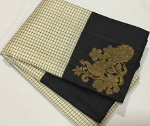 Vaibhogam- Stunning offwhite with black Handwoven Pure Jari Korvai Kanjivaram Silk with beautiful muted checks woven body with gorgeous peacocks woven on either side of the borders with beautiful pallu and contrast black blouse