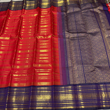 Vaibhogam- Gorgeous Red with Deep Blue Handwoven Pure 2g Jari Kanjivaram Silk with beautiful Jari veldhari striped body with different patterns rich varisaipet borders gorgeous pallu and contrast deep blue jari woven blouse