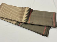 Gorgeous Handwoven Pure Zariless Korvai Kanjivaram Silk Saree in ivory with grey and black combination with temples woven long borders striped body classic seer pallu in black and contrast black blouse
