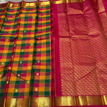 Sahana-Stunning Palum Pazhamum Checks with Beautiful Traditional set of shades with gorgeous jari checked body with mayil chakram buttas woven with bawanchi borders rich arakku pallu and contrast arakku blouse. A beautiful piece for this wedding season!