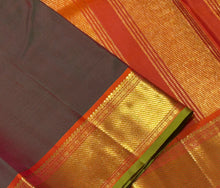 Nayaki- Mesmerizing Manthulir Green with Orange Handwoven Pure Kanjivaram Silk with beautiful bawanchi borders with rich pallu and contrast woven blouse
