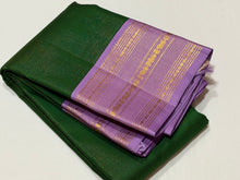 Vaibhogam- Gorgeous Deep Emerald Green with Lavendar  Korvai Handwoven Pure Jari Kanjivaram Silk with Vairaoosi Body with beautiful borders rich pallu and contrast Vairaoosi woven lavendar blouse