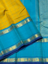 Sarasangi-Gorgeous Golden Lemon Sampanga with Sky Blue handwoven pure Jari Korvai Kanjivaram Silk with beautiful checked body with rich rettapet borders with deep blue jamudu , seer rich pallu and contrast woven blue blouse