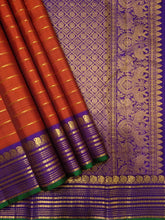 Sahana- Stunning  Burnt Orange with Purple Handwoven Pure Jari Kanjivaram Silk with Jari Veldhari Body with rich borders pallu and contrast woven blouse