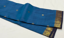 Vaibhogam- Mesmerizing Royal Azure Blue with Navy Blue Handwoven Pure 2g Jari Korvai Kanjivaram Silk with Buttas woven body with beautiful small intricate borders rich pallu and contrast navy blue blouse
