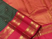 Stunning Bottle Green with Red Handwoven Pure Jari Korvai with Doublepet Rich Borders Gorgeous Pallu and Contrast Woven blouse in a Kai Korvai Handwoven Kanjivaram Silk Saree