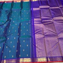 Sahana- Gorgeous Peacock Blue with Violet Combo in a handwoven pure jari Buttas Kanjivaram Silk with small borders orange jamudu with rich pallu and contrast woven blouse