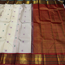 Vaibhogam-Stunning  Offwhite with Ganga Jamuna borders with gorgeous pattu buttas woven body with deep emerald green and burnt orange shade borders beautifully woven rich pallu and contrast woven blouse