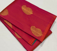 Saranga- Gorgeous Dual tone Orange With Turquoise Green Borderless Handwoven Pure Jari Kanjivaram Silk with Muthukattam woven body with beautiful paisley motifs rich 1000 buttas style woven pallu and contrast woven blouse