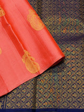 Saranga- Beautiful Peach with Navy Blue Borderless Handwoven Pure Jari Kanjivaram Silk with Muthukattam and Paisleys with peacock and annapakshi Buttas woven body with rich pallu and contrast navy blue blouse!