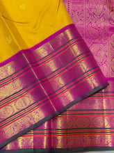 Vaibhogam- Gorgeous Yellow with Rani Pink Handwoven Pure 2g Jari Korvai with Buttas Kanjivaram Silk with varisaipet borders with green selvedges and rich woven pallu and contrast woven blouse
