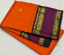 Vaibhogam- Stunning Fanta Orange with Kanchana Black Handwoven Pure Jari Korvai Kanjivaram Silk with beautiful buttas woven body with intricate doublepet with middle silk thread woven borders gorgeous kalakshetra parrots woven pallu and contrast blouse