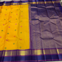 Vaibhogam- Gorgeous Yellow with Blue Handwoven Pure 2gJari Korvai Kanjivaram Silk with beautiful gandaberundas woven silk buttas in body with beautiful spaced meenakari woven borders rich pallu and contrast woven blouse