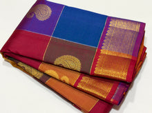Vaibhogam- Stunning Palum Pazhamum checks in a unique and unusual palette of colors with paisley buttas woven body with rich bawanchi borders gorgeous and beautifully woven pallu in arakku with contrast checked arakku blouse