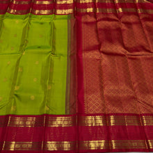 Vaibhogam- Gorgeous Parrot Green with Red Handwoven Pure Zari Korvai Kanjivaram Silk with Buttas woven body with rich doublepet vairaoosi borders with rudrakshas woven beautiful rich pallu and contrast woven red blouse