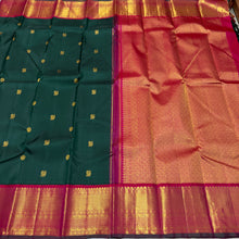 Vaibhogam- Stunning Bottle Green with Tomato Orange Pink Handwoven Pure 2gram Jari Korvai with Mayil Chakram Buttas Kanjivaram Silk with rich borders beautiful pallu and contrast woven blouse