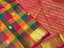 Sahana-Stunning Palum Pazhamum Checks with Beautiful Traditional set of shades with gorgeous jari checked body with mayil chakram buttas woven with bawanchi borders rich arakku pallu and contrast arakku blouse. A beautiful piece for this wedding season!