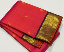 Vaibhogam-Beautiful Double tone Tomato Pink with deep maroonish brown with orange selvedges Handwoven Pure Korvai Kanjivaram Silk with floral buttas woven body beautiful elephants and annapakshis woven gorgeous borders rich pallu and contrast woven blouse