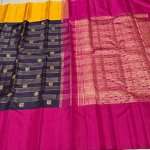 Vaibhogam- Stunning Deep Kanchana Blackish Purple with Yellow and Rani Pink Combination with Vairaoosi and middle thick strips where mayil chakram motifs are woven with beautiful broad ganga jamuna borders with rich pallu and contrast vairaoosi blouse