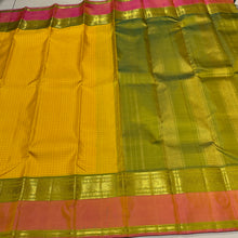 Sahana- Gorgeous Sunshine Yellow with Muthukattam Handwoven Beautiful Pure Jari Kanjivaram Silk with beautiful peachish pink with Olive Green spaced borders rich olive green pallu and contrast woven blouse