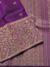 Vaibhogam- Stunning Deep Purple with Gold Handwoven Pure 2g Jari Kanjivaram Silk with beautiful yazhi and mayil buttas woven body with rich Vanasingaram borders on either sides with rich pallu and self colored blouse