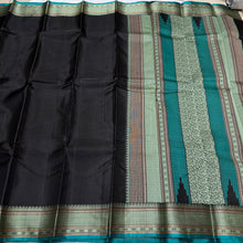 Mindblowing Black with Teal Handwoven Pure Zariless Kanjivaram Silk with intricately woven self Muthukattam body checks rich borders gorgeous pallu and Jacquard blouse beauty