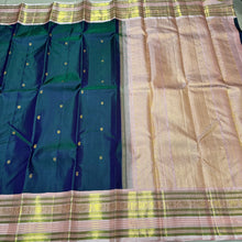 Deep Prussian Blue (dual tone of sapphire blue and green) with Soft Pink Buttas Handwoven Pure Jari Korvai Kanjivaram Silk Saree with rich meenakari varisaipet borders with vel, annam, manga, Neli streaks woven rich borders rich pallu and contrast woven