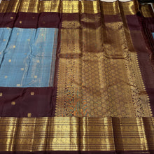 Vaibhogam-Beautiful Pastel Blue with Dark Brown Handwoven Pure Jari Korvai Kanjivaram Silk with Vairaoosi with buttas woven middle body with coffee brown buttas woven lower body and rich broad borders gorgeous pallu and contrast woven blouse