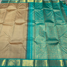 Beautiful Beige with Turquoise Green Handwoven Pure Jari Korvai Kanjivaram Silk with beautiful Yazhis and Annapakshis woven borders rich pallu and contrast woven blouse