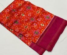 Arabhi- Stunning Orange with Pink in a beautiful Handwoven Premium Zariless Double Ikat Silk with rich woven body gorgeous pallu and contrast woven blouse