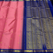 Sarasangi- Gorgeous Peachish Pink with Blue Handwoven Pure Jari Korvai Kanjivaram Silk with Oru kunjam Pillayar moggu with body buttas woven rich meena buttas woven pallu and contrast woven blouse