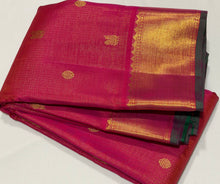 Vaibhogam- Beautiful Dual tone Orange Pink with Green Vairaoosi with Buttas Handwoven Pure Jari Kanjivaram Silk with rich bawanchi borders with green selvedges gorgeous Kalakshetra Kili Pallu and contrast green Jari striped blouse
