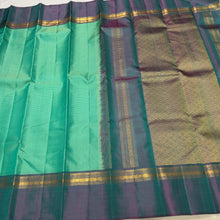 Sahana- Beautiful Turquoise Green with Teal Shot Purple  Muthukattam Handwoven Pure Jari Kanjivaram Silk with beautiful body spaced borders rich pallu and contrast woven blouse