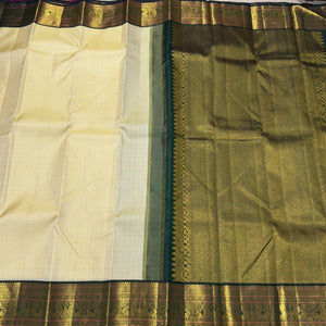 Creamish white with bottle green Handwoven Pure Jari Korvai muthukattam with beautiful borders Kanjivaram Silk Saree Beauty