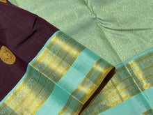 Gorgeous Dark Kanchana Brown with dual tone aqua blue green Handwoven Pure Jari Korvai Kanjivaram Silk Saree with Rich Peacock Buttas Woven body beautiful borders rich pallu with intricate motifs and contrast woven blouse