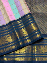 Vaibhogam- Beautiful Palum Pazhamum Jari Checks in pastel palette of colors in Handwoven Pure Zari Korvai Kanjivaram Silk with rich jari checks body with Deep sapphire blue borders intricate and beautifully woven with rich pallu and contrast blouse